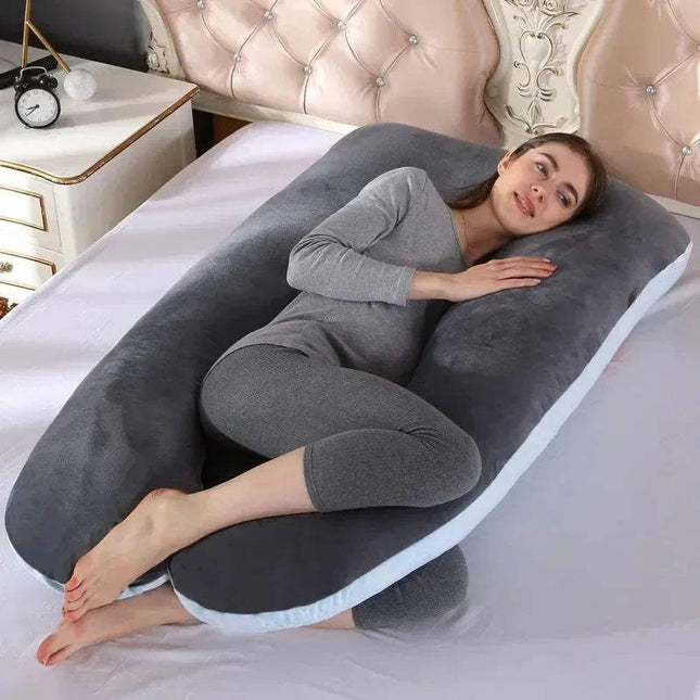 Woman lying on a U-shaped 130x70cm Pregnancy Pillow for Full-Body Support in a bedroom setting.