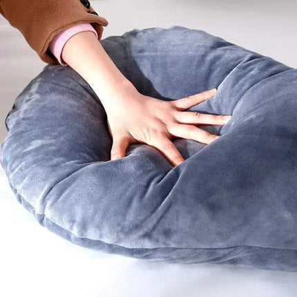 Person holding a 130x70cm Pregnancy Pillow on a white background