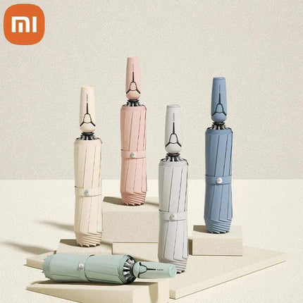 Xiaomi Full Automatic Reverse Umbrella in various colors displayed artistically on a neutral background. - Astoria Lifestyle