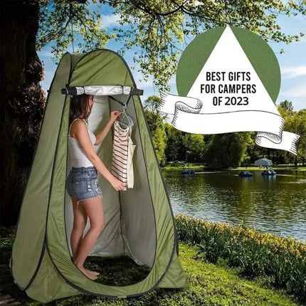 Pop-Up Privacy Tent in use as a portable changing room by a woman outdoors near a lake, perfect for campers.