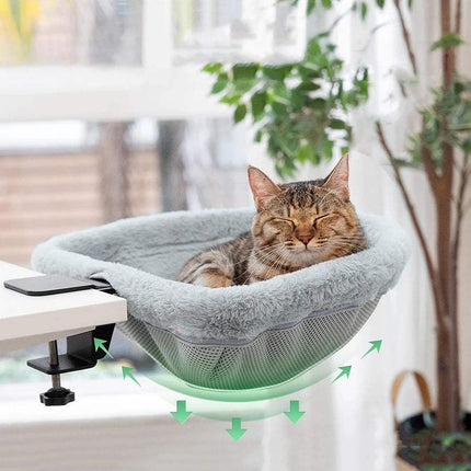 Cat relaxing in a Foldable Cat Desk Bed hammock attached near a desk, providing a cozy space-saving resting spot. Astoria Lifestyle