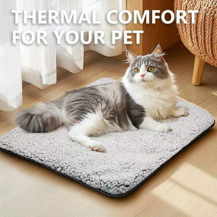 Soft and cozy Self-Heating Pet Pad with a cat resting comfortably on it.