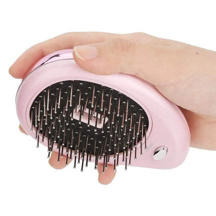 Hand holding the Anti-Static Ionic Vibrating Hair Brush for smooth and frizz-free hair.