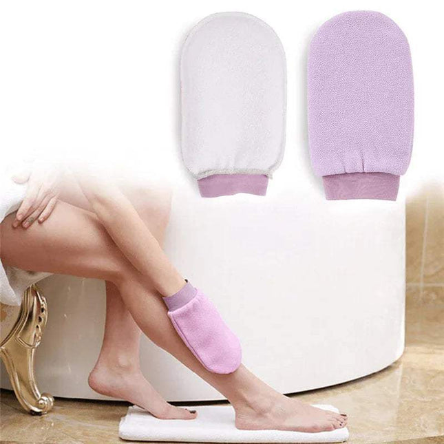 Person using 2x Exfoliating Bath Glove for Deep Body Cleansing on feet with a white bathtub in the background