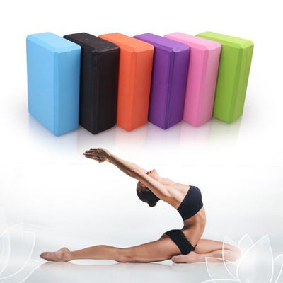 2x Yoga Block Set in various colors with a woman practicing a stretching pose on a mat.