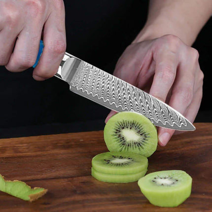 3.5 Inch Paring Knife VG10 Damascus Steel  Person slicing kiwis with a knife on a wooden cutting board