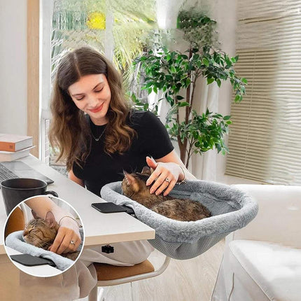 A person using a Foldable Cat Desk Bed while petting their cat, showcasing a cozy and space-saving design. Astoria Lifestyle