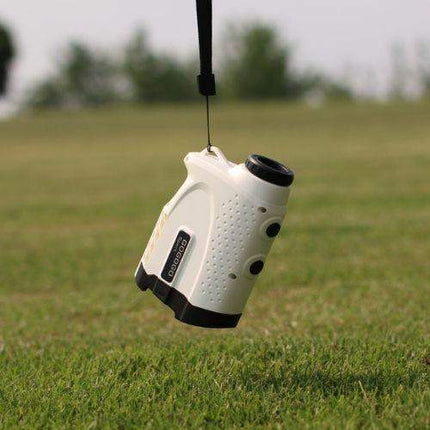 Rangefinder Golf hanging on a strap, designed for high accuracy measuring up to 650 yards on the golf course.