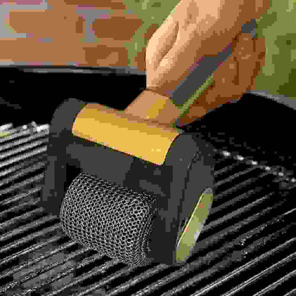 Electric Grill Cleaner Roller removing debris from barbecue grill grates with a cordless design for easy cleaning. Astoria Lifestyle