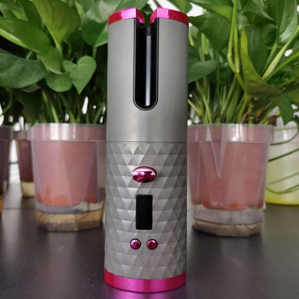 Cordless Hair Curler designed for effortless curls, featuring a sleek grey and pink design with a user-friendly interface.