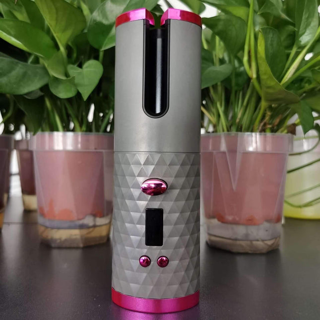 Cordless Hair Curler designed for effortless curls, featuring a sleek grey and pink design with a user-friendly interface.