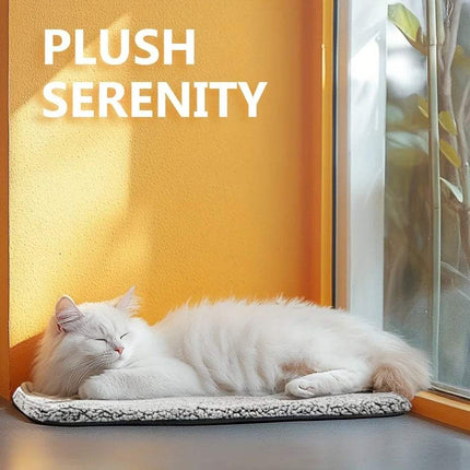A fluffy white cat sleeping on a Self-Heating Pet Pad by the window, enjoying cozy warmth in a serene environment.
