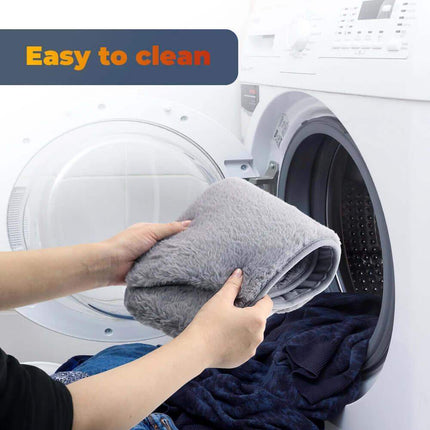 Person placing a soft, gray Electric Heating Waist Belt in the washing machine, labeled 'Easy to clean'.