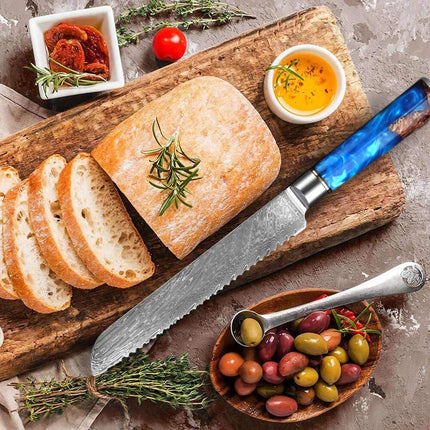 7 Inch Bread Knife Damascus Steel. Sliced bread with a knife, herbs, and olives on a wooden board.