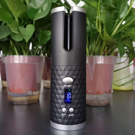 Cordless Hair Curler for effortless styling with convenient digital display and sleek design, surrounded by green plants.