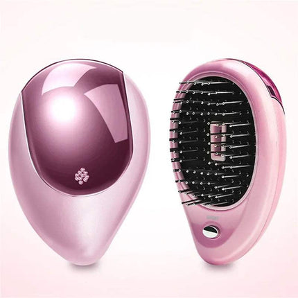 Anti-Static Ionic Vibrating Hair Brush, sleek pink design, electric brush for smooth frizz-free hair.
