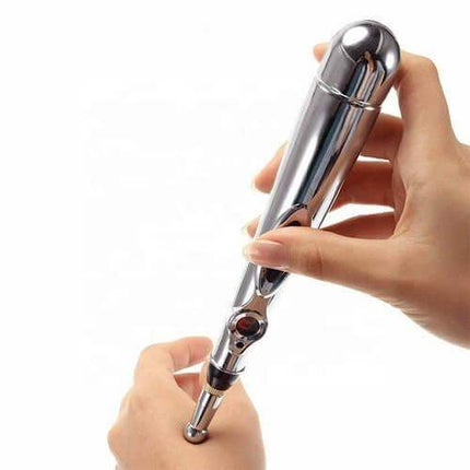 Person using an Acupuncture Pen to relieve pain and promote relaxation on the wrist.