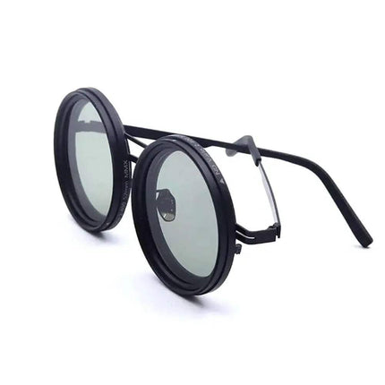 Adjustable Dimming Sunglasses Round sunglasses with black frames and clear lenses on a white background