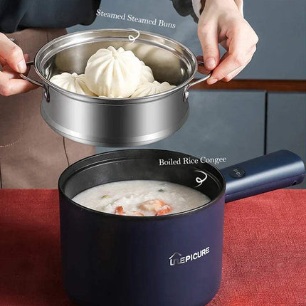Person holding an All-In-One Mini Electric Cooker with steamed buns above a blue Epicure pot containing boiled rice congee.