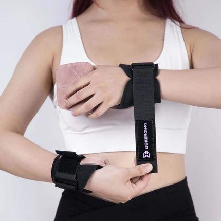 Person wearing black Weightlifting Grip Pads a visible brand logo on a white background