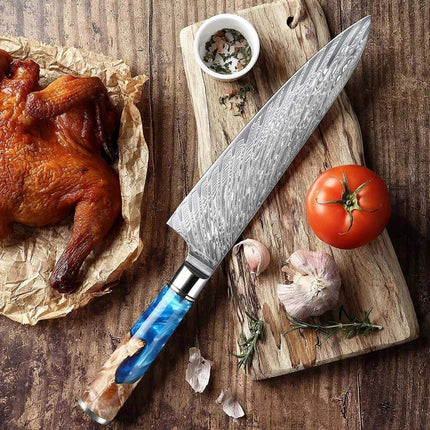 8 Inch Chef Knife with blue handle on a wooden cutting board with roasted chicken, tomato, and garlic.