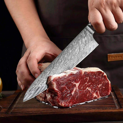 8 Inch Chef Knife. Person cutting a steak with a large knife on a wooden cutting board.