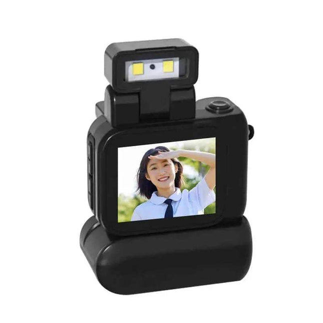 Mini Monoreflex Style Camera black with a screen displaying a person saluting, on a white background