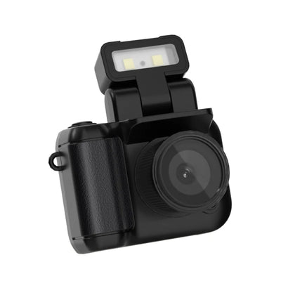 Mini Monoreflex Style Camera black with flash on a white background