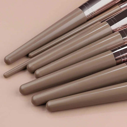 Professional Makeup Brush Set displayed on a smooth surface, showcasing elegant design and variety for flawless application.