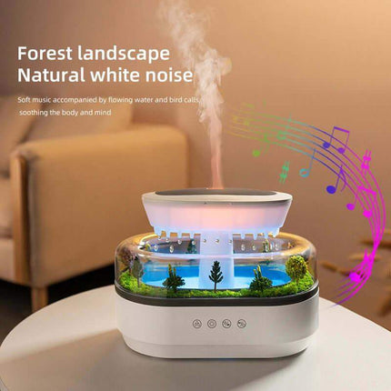 Rain Cloud Aroma Diffuser with forest landscape display on a table, featuring soft music and nature sounds.