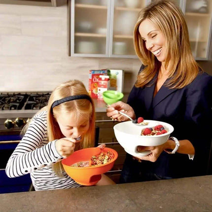 Separated Cereal Bowl used by mother and daughter enjoying crunchy cereal and fresh fruit for breakfast.