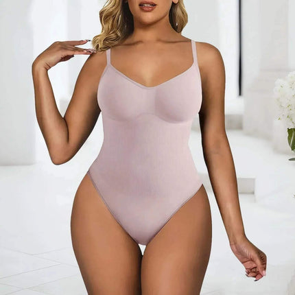 Seamless High Elastic Bodysuit for Women. Woman wearing a light pink bodysuit against a white background