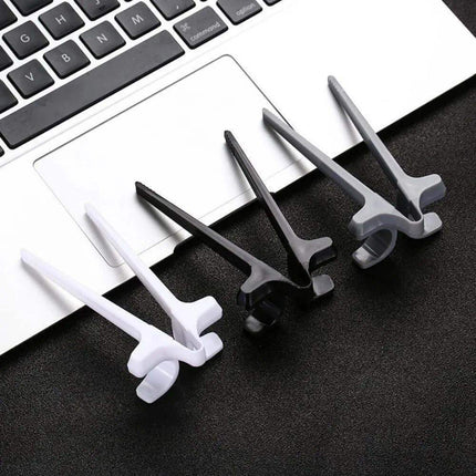 Snack Grabbers sets on a black surface with a laptop keyboard in the background