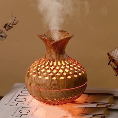 300ml Wooden Air Humidifier emitting steam on a surface with a magazine in the background