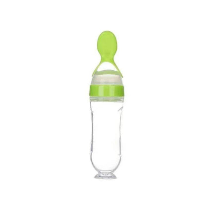 Clear Baby Feeding Squeeze Spoon Safe, Easy, and Mess-Free Feeding with green cap and handle on a white background
