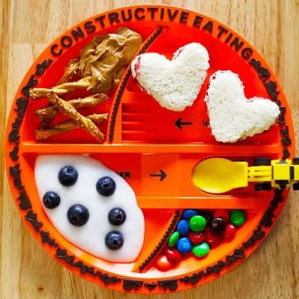 Constructive Eating Tableware Set featuring a colorful plate with fun food arrangement for interactive meals.