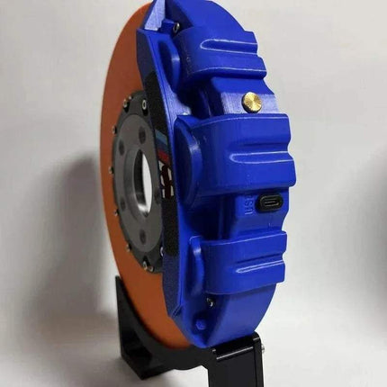 Creative DIY Brake Disc LED Atmosphere Light displayed in blue and orange with modern design features.