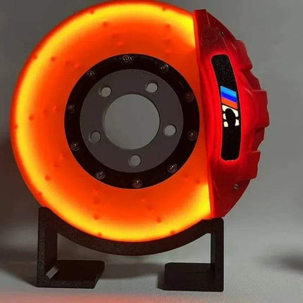 Creative DIY Brake Disc LED Atmosphere Light décor featuring vibrant orange ambient glow.