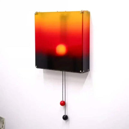 Kinetic Sunrise Wall Light adjustable sunset glow lamp displayed on a wall with a gradient sunset design.