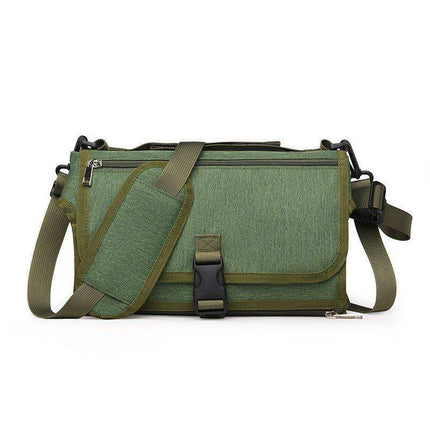 Green Portable Baby Changing Pad Foldable Waterproof Diaper Mat for Travel bag with a strap on a white background