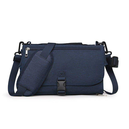 Blue Portable Baby Changing Pad Foldable Waterproof Diaper Mat for Travel bag with a strap on a white background