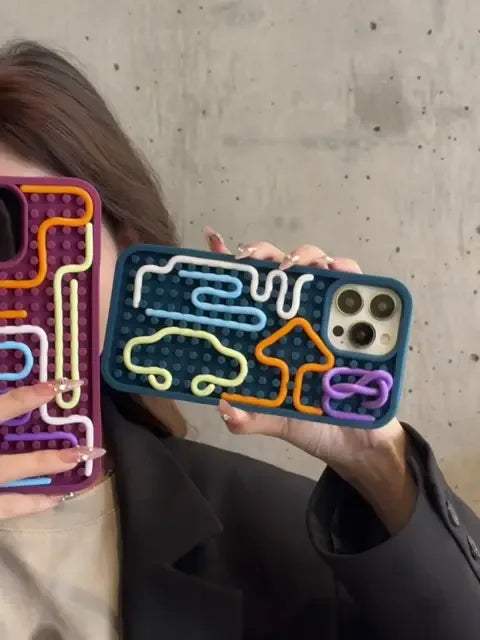 Stress-Relieving Phone Case showing colorful tactile designs for anxiety relief and stress reduction.