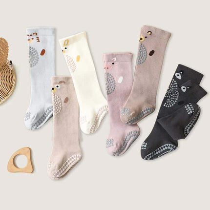 Baby Knee Non-Slip Floor Socks Set of baby socks with animal patterns on a light background