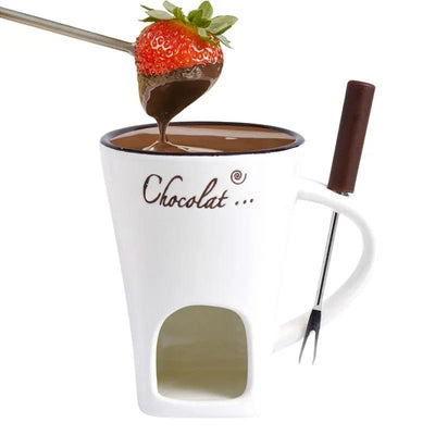 Ceramic Fondue Mug white with 'Chocolat' text, chocolate fondue pot, and strawberry being dipped into chocolate on a white background.