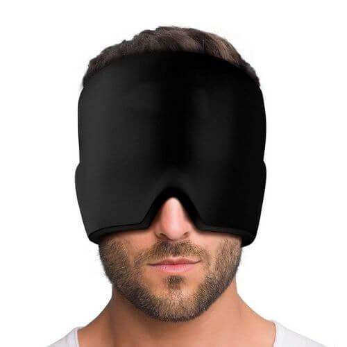 Person wearing a Cold Therapy Migraine Relief Cap on a white background
