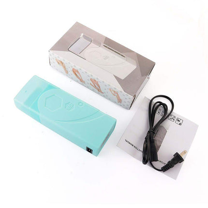 Turquoise Depilatory Wax Heater with packaging, cable, and manual on a white background
