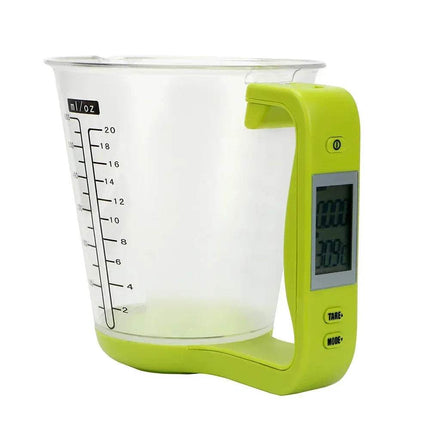 Digital measuring cup with green handle and clear container on a white background. Astoria Lifestyle