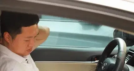 Man using Dual Pressure Point Massager for instant pain relief in a car, relieving neck and shoulder tension.