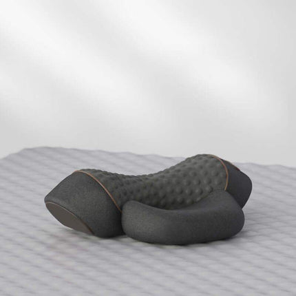 Gray Electric Neck Massage Pillow on a striped fabric background