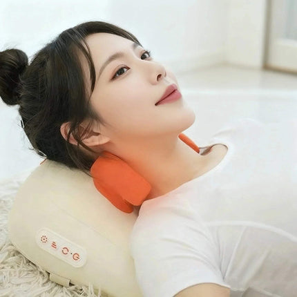 Woman relaxing with the Electric Trapezius Massage Pillow, enjoying soothing heat and shiatsu massage. - Astoria Lifestyle
